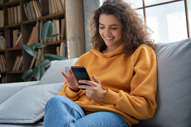 woman reading on her phone